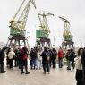Trip to Wolin Island – a group of students with the Szczecin Cranes in the background