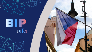 Promotional graphic announcing a BIP (Blended Intensive Programme) offer in the Czech Republic, featuring the Czech national flag displayed on a street with historic buildings in the background and modern geometric design elements.