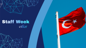 The Turkish flag waves against a clear blue sky, shown beside a blue graphic panel with the words “Staff Week offer” in bold white text and geometric line patterns.