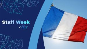The French flag waves against a clear blue sky, shown beside a blue graphic panel with the words “Staff Week offer” in bold white text and geometric line patterns.